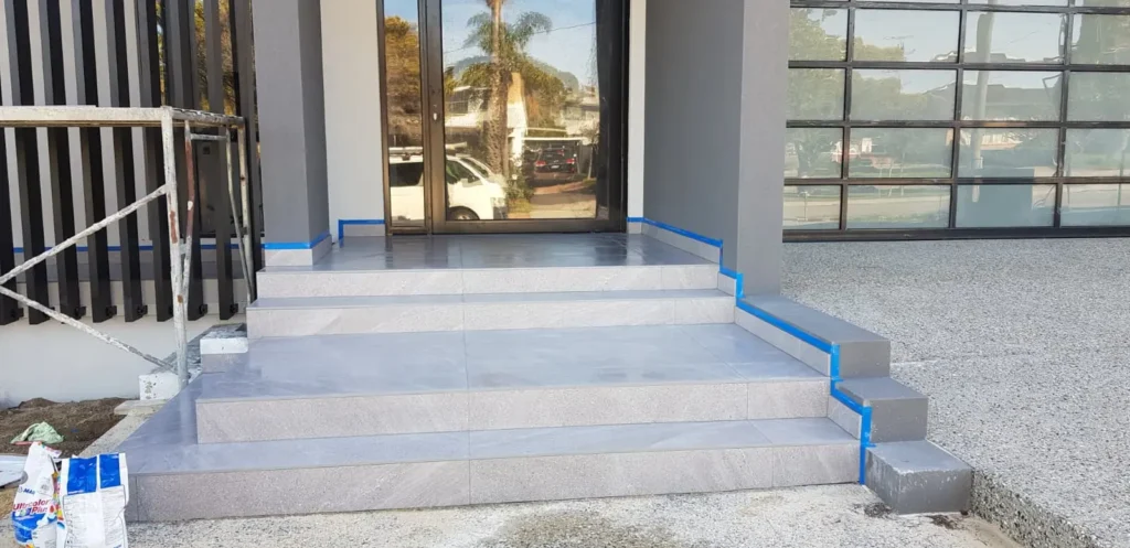 Modern outdoor porcelain tile installation on front entrance steps by HDR Tiling & Stone in Perth