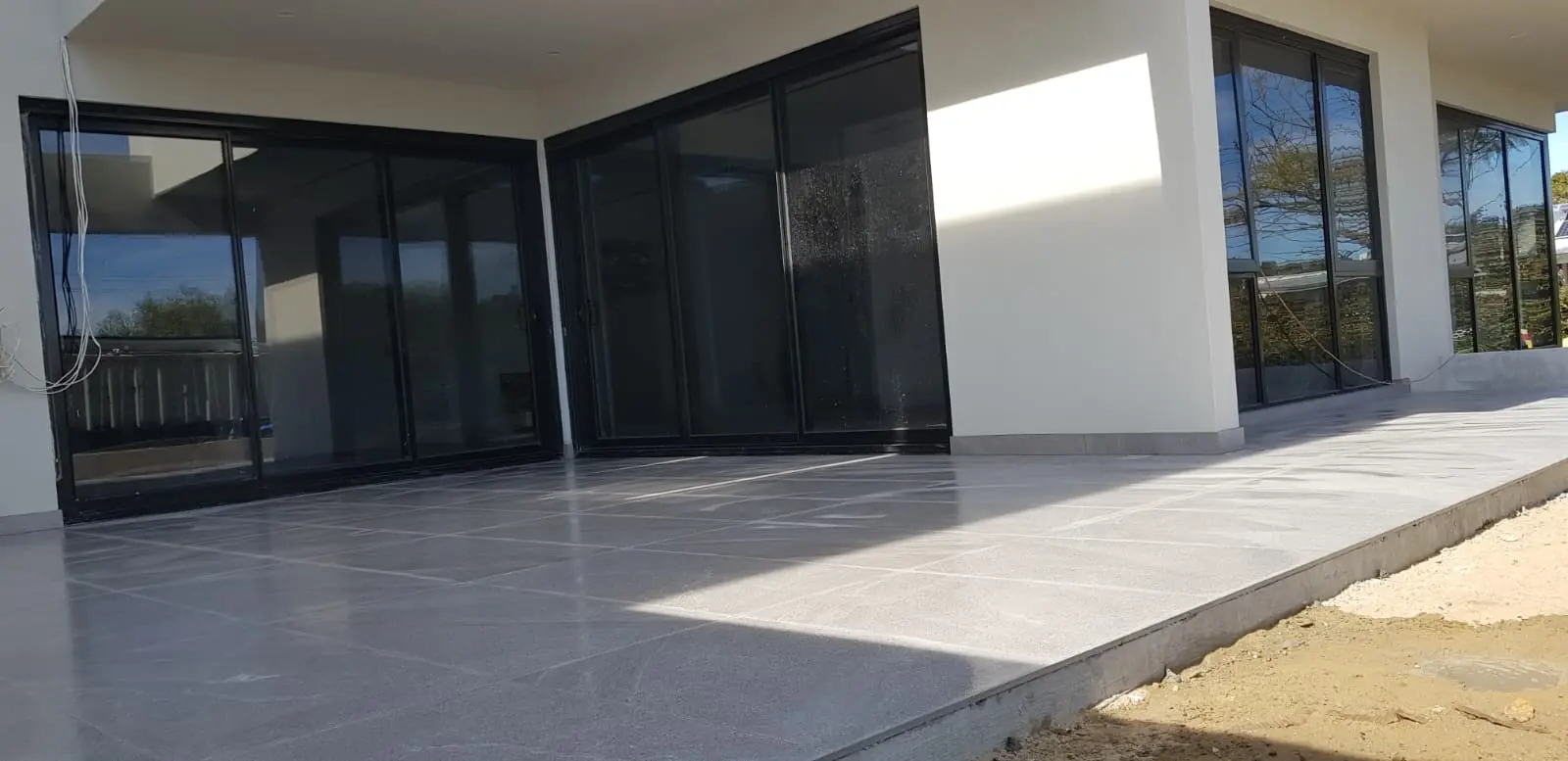 Professional alfresco tiling with premium porcelain tiles for a modern outdoor entertaining area in Perth